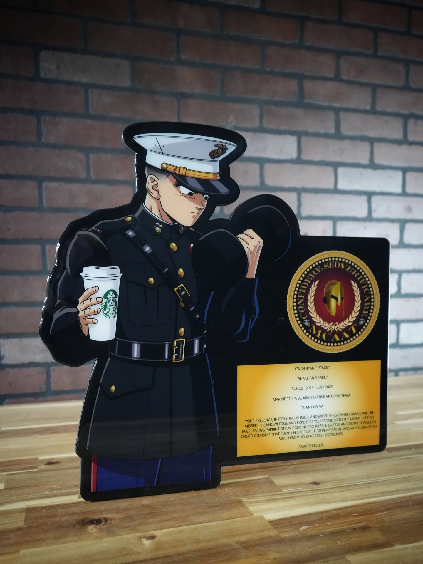 Anime Marine in dress blues holding a Starbucks cup and dumbbell on a custom Oak Place plaque