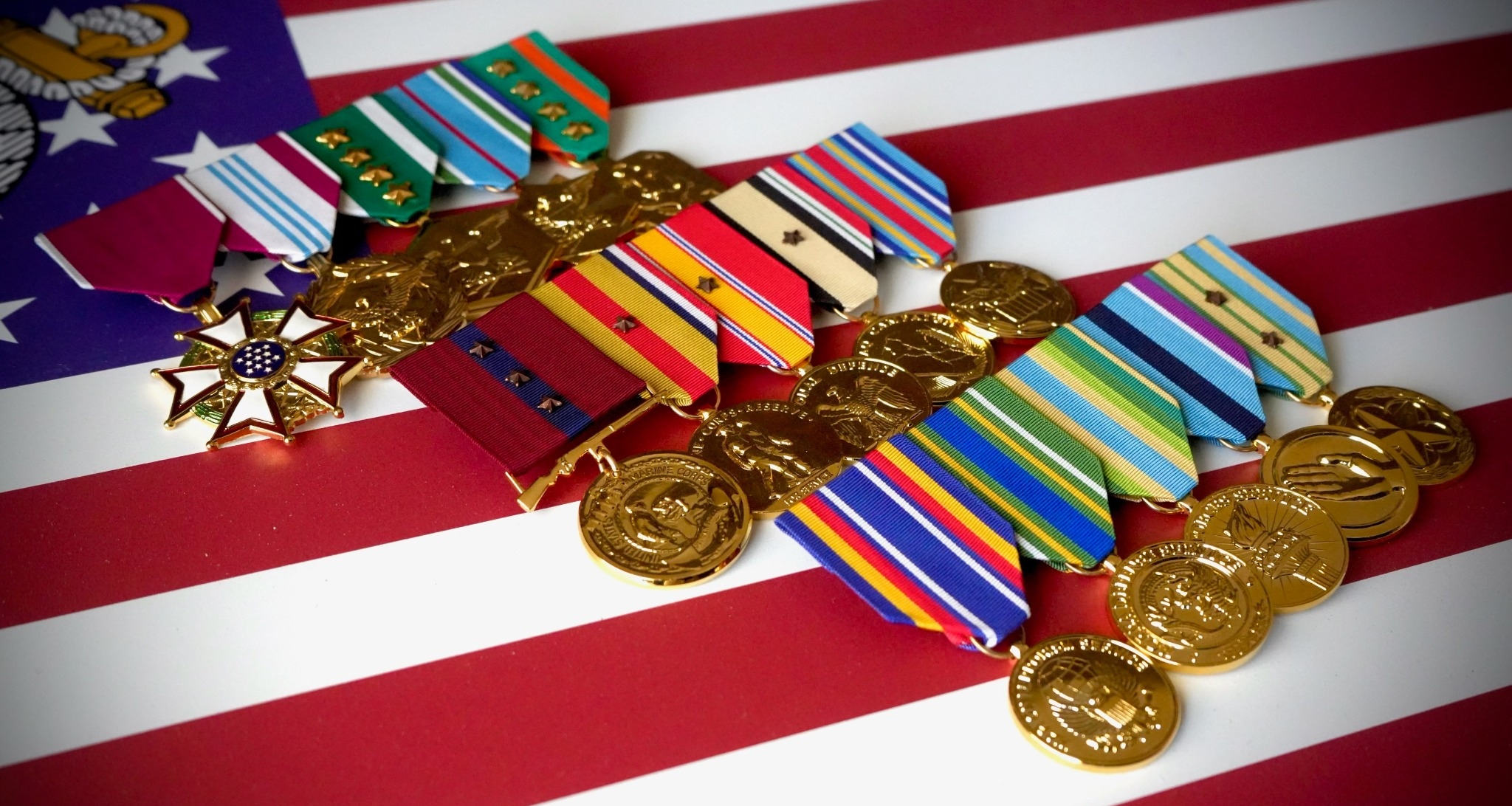 Military medals displayed on an American flag
